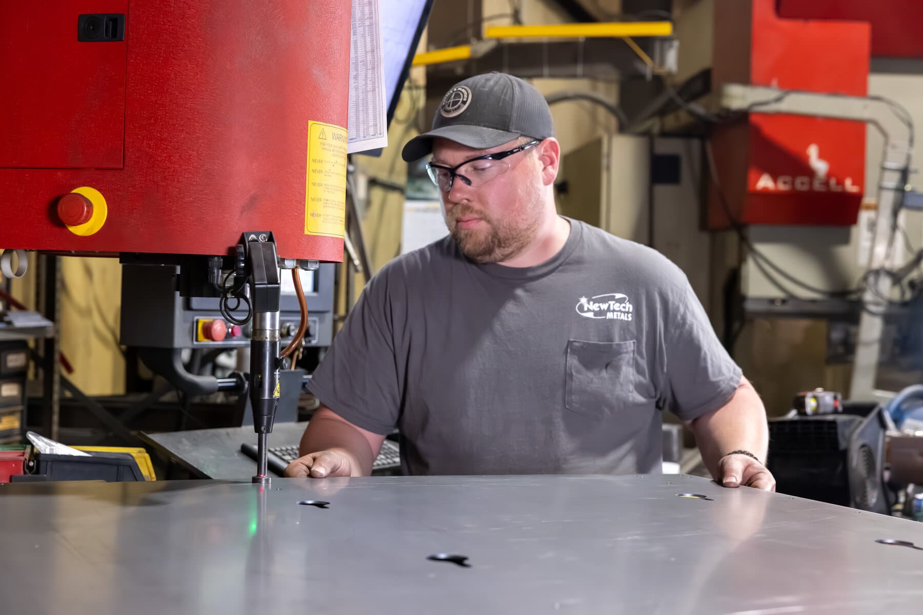 Press-fit PEM hardware insertion on a sheet-metal panel