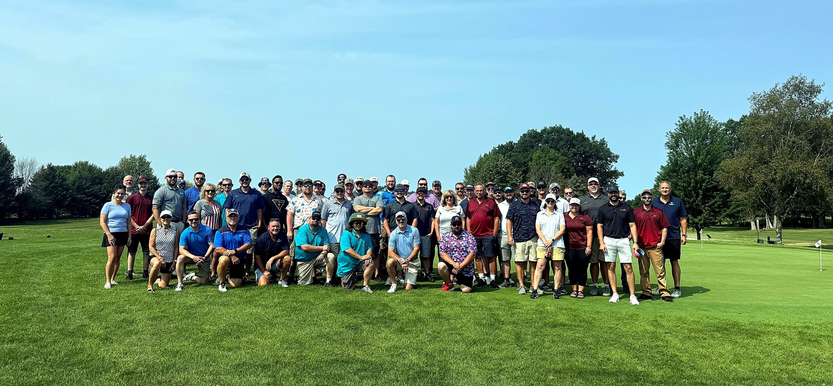 The New Tech Metals team together in company polos at the annual golf outing