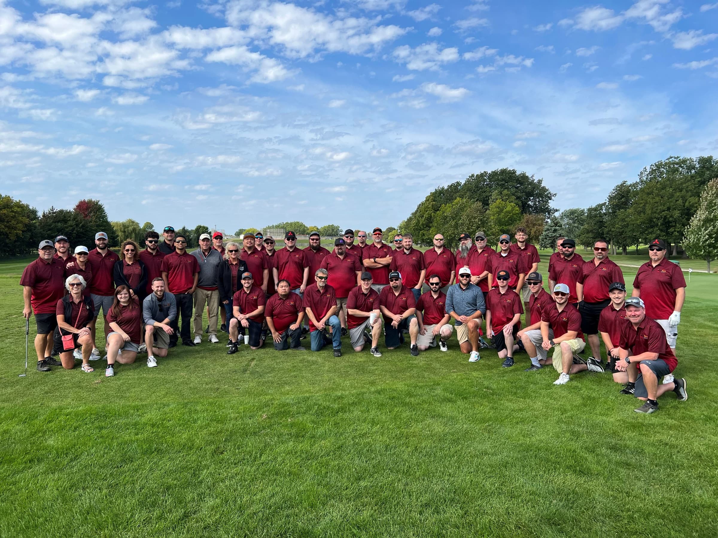 The New Tech Metals team together in company polos at the annual golf outing