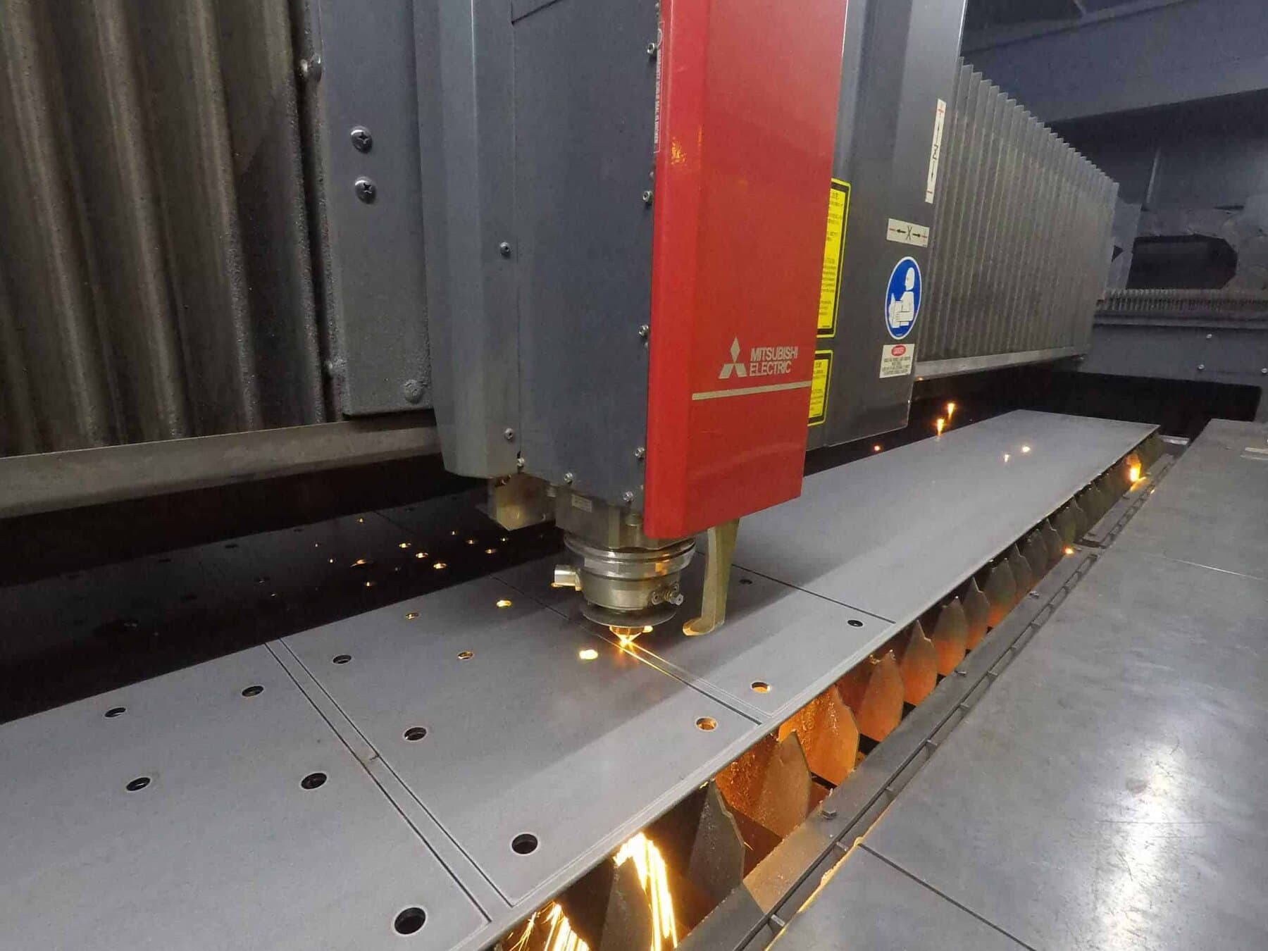 Mitsubishi Electric fiber laser cutting steel sheet