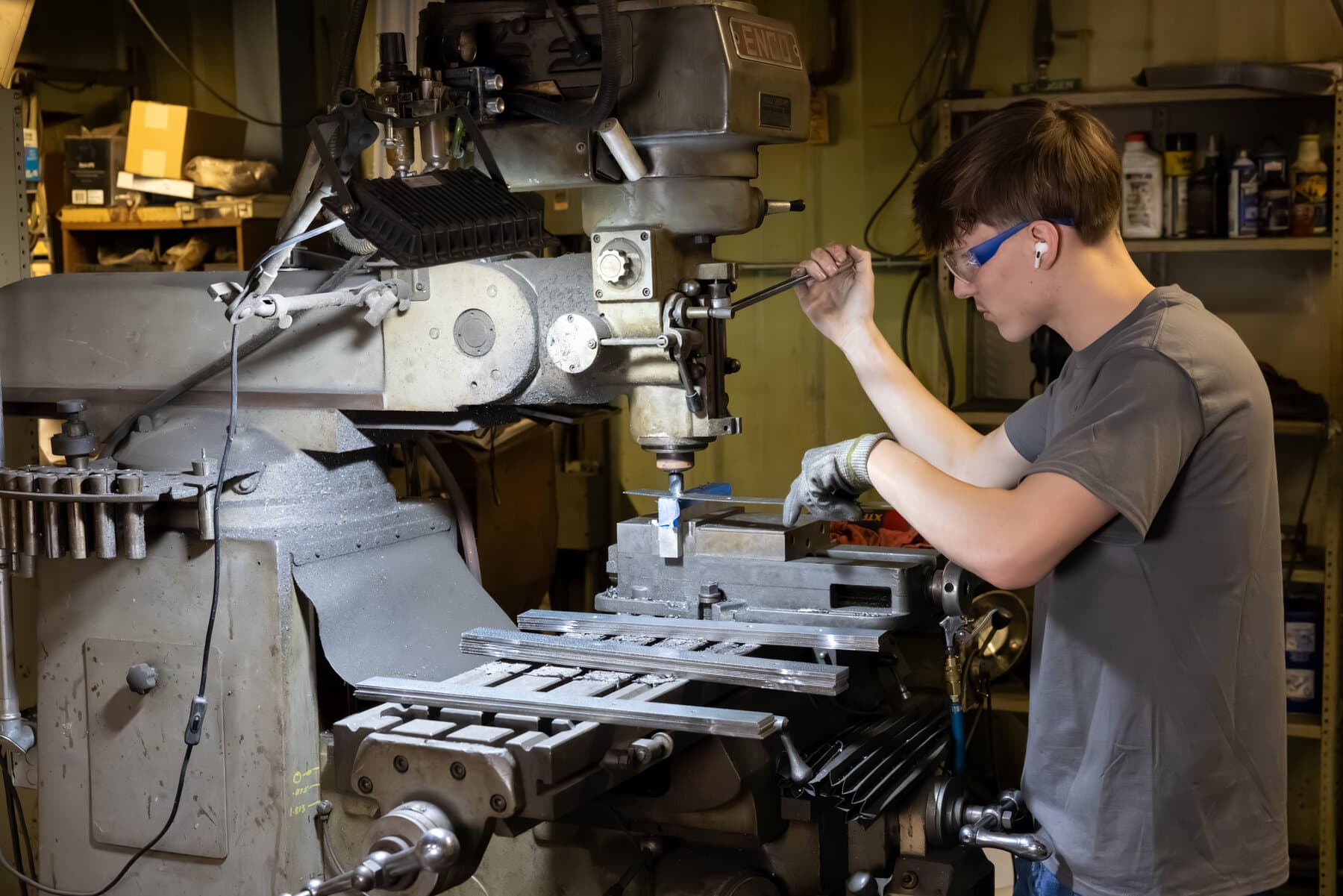 Close-up of a CNC countersinking operation on a metal part