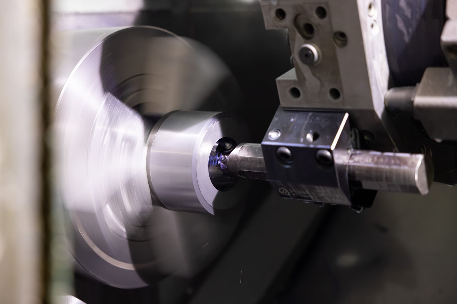 Part spinning in a Haas CNC lathe during a turning operation