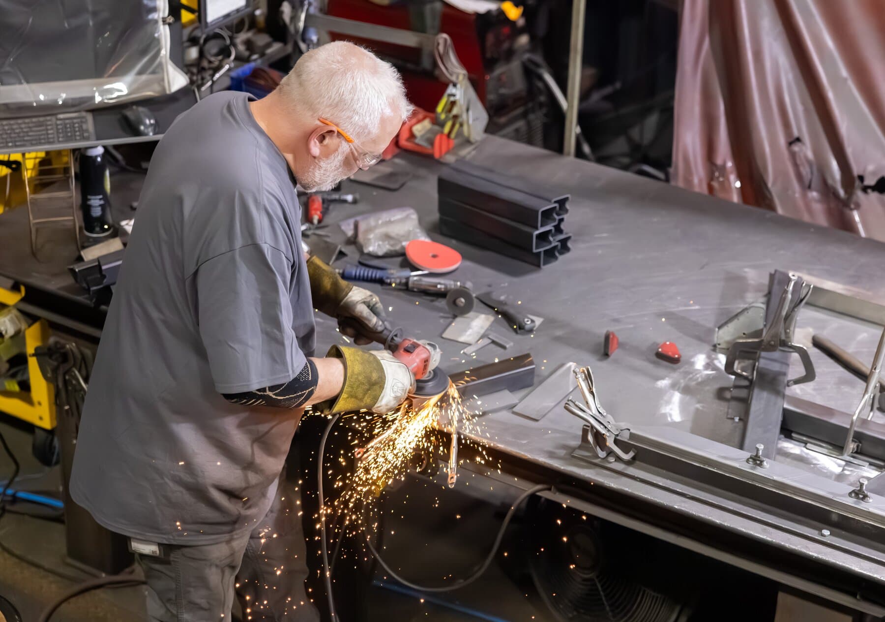 Overhead view of a New Tech Metals welder preparing a part for welding